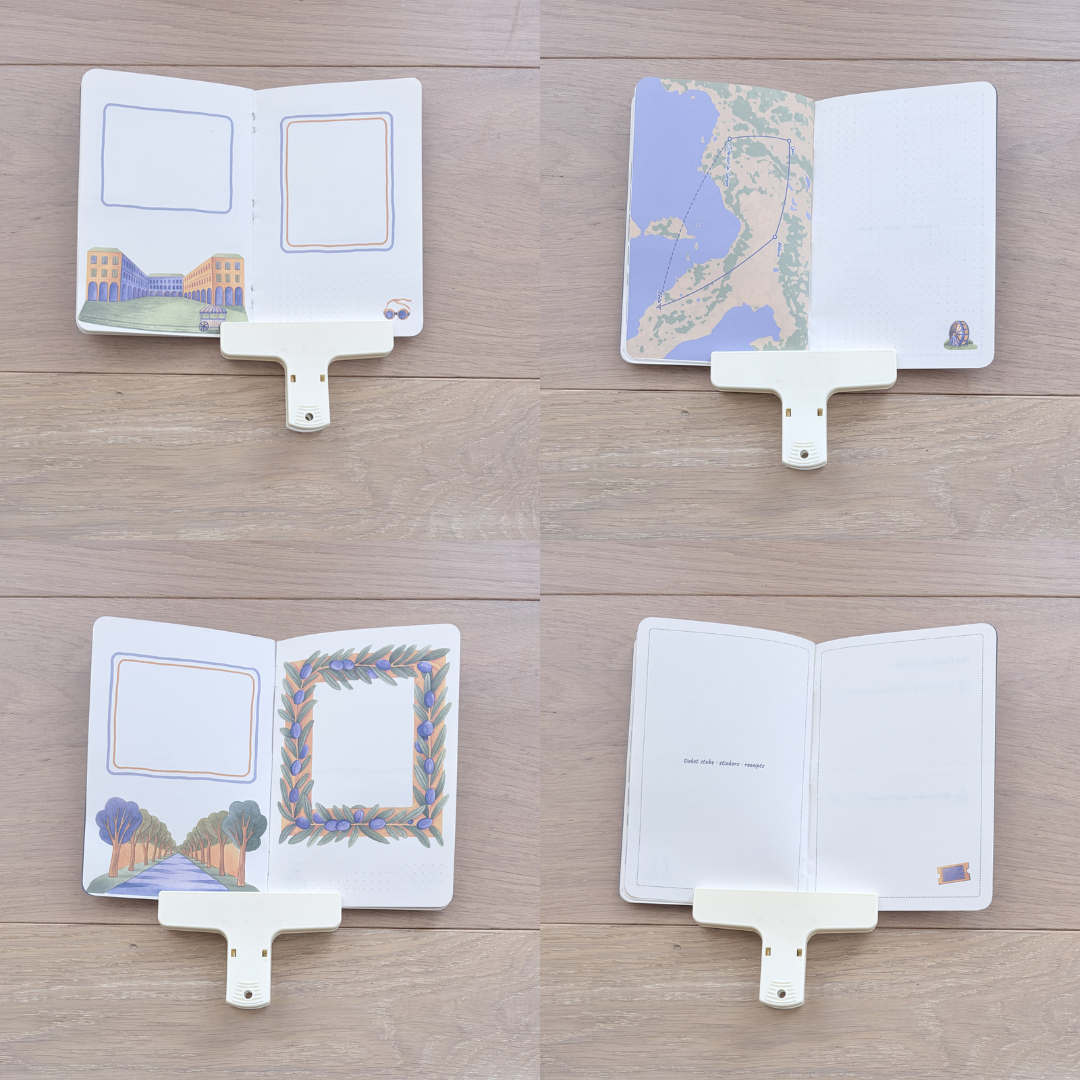 Four mini travel photo albums with white plastic clip-on hangers, arranged in a 2x2 grid on a light wood background. Each album is shown open with different sample inserts, including a map of Japan, a campus building illustration, a landscape with trees, and blank pages.